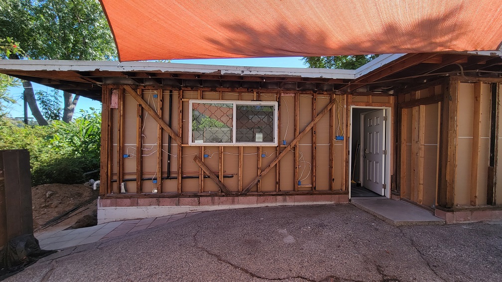 Exterior ADU retrofit with framing exposed.