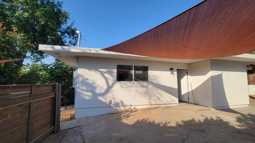 Completed exterior remodel with new stucco.